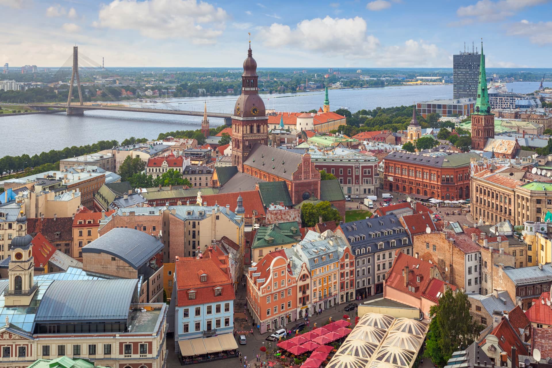 Aerial view of Riga Old Town and the Daugava river, with cruise ships visible at the passenger terminal